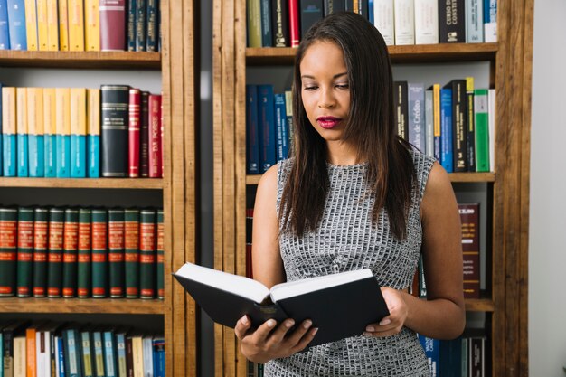 African American young lady reading book