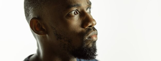 African-american young man's close up shot on studio background, flyer