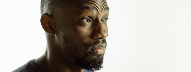 African-american young man's close up shot on studio background, flyer