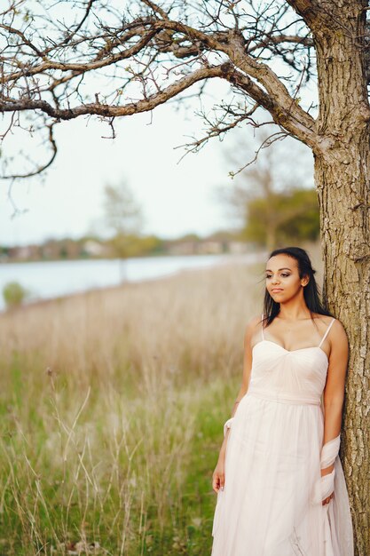 African-American young woman, the grass with the lovely green color