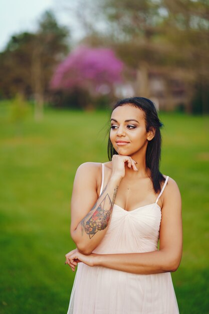 African-American young woman, the grass with the lovely green color