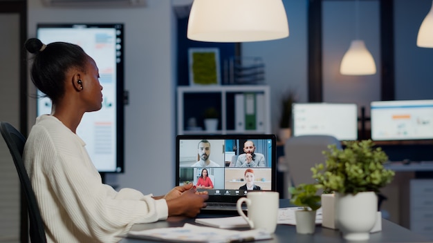 African businesswoman talking during video conference with team