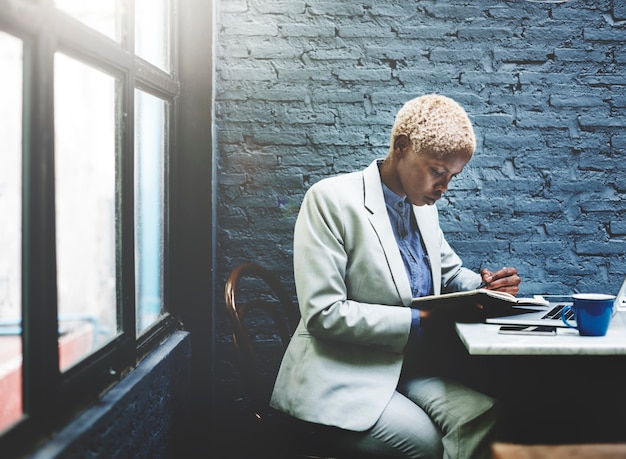 African descent woman working at a desk