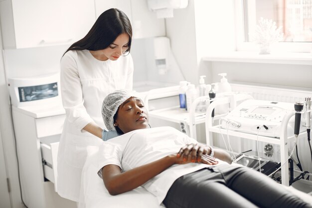 African girl. Woman on couch. Lady at  beautician.