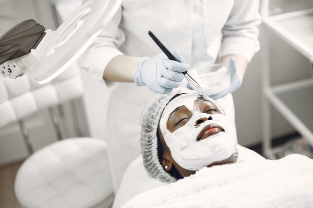 African girl. Woman on couch. Lady at  beautician.