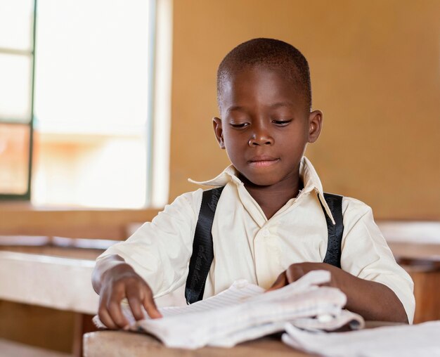 African kid learning in class