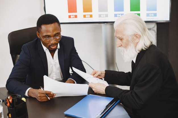 African man in a black suit.