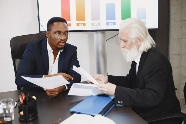 African man in a black suit.