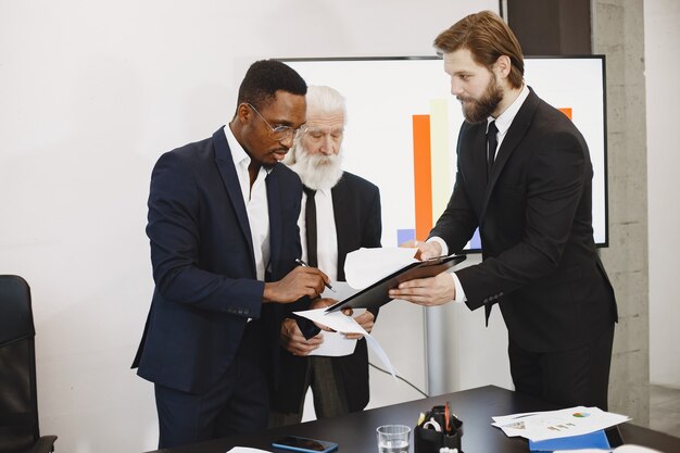 African man in a black suit.