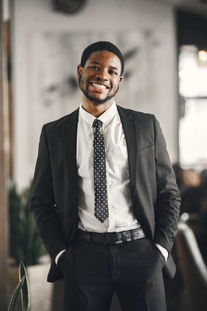 African man in a black suit.