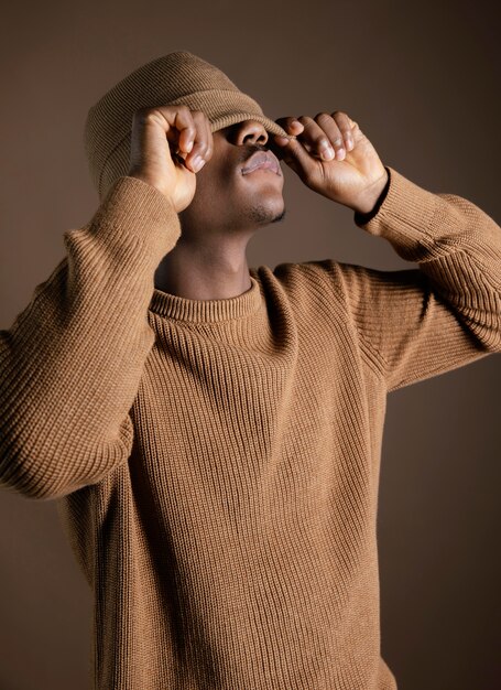 African man with cap covering eyes