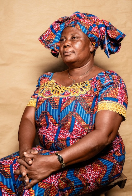 Local women Ghana bare breast Africa African stand pose formal seated chair  west skirt dress local benin bight coast Stock Photo - Alamy