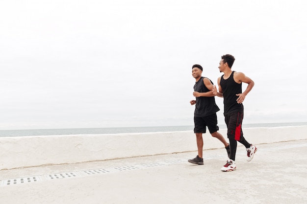 African sports men friends running outdoors