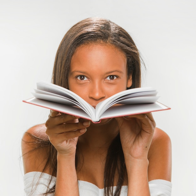 African teenage girl holding notebook