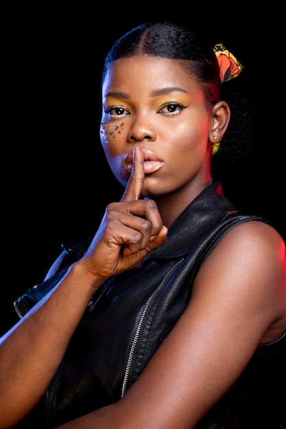 African woman doing the silence sign