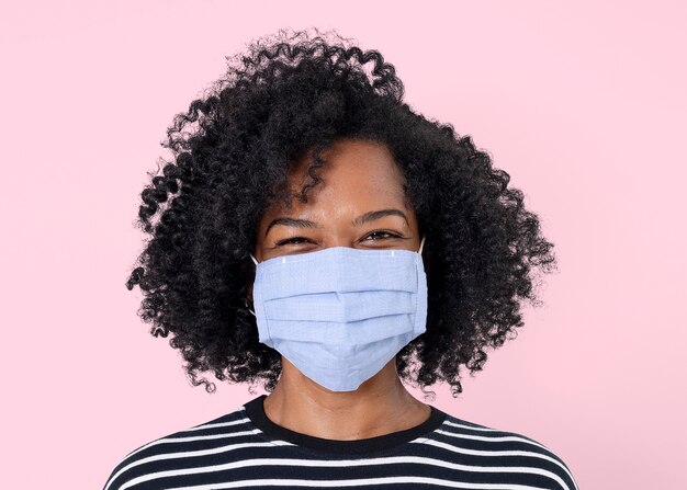 African woman mockup psd wearing face mask in the new normal