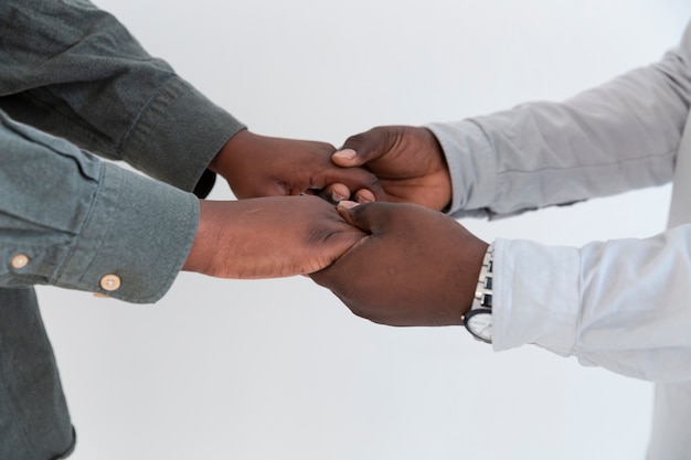 Afro-american people hands holding each other