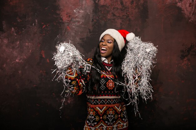 Afro american woman on a Christmas party with confetti