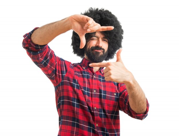 Afro man  focusing with his fingers