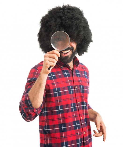 Afro man with magnifying glass