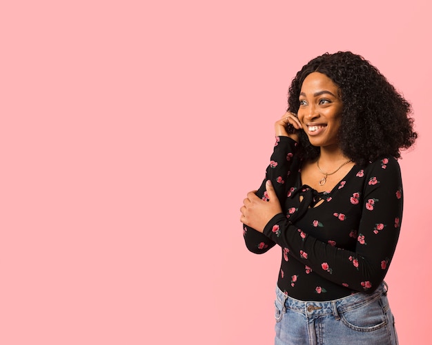 Afroamerican lady looking at copy space