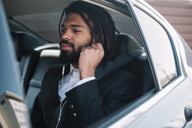 Afroamerican man listening to music