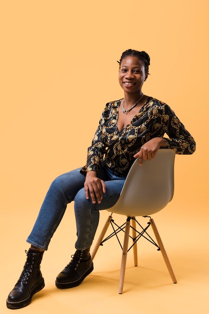 Afroamerican model sitting on chair