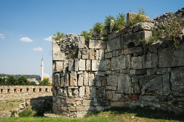 Aged building under the sunlight and a blue sky in Skopje, North Macedonia