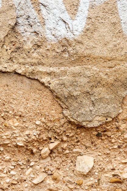 Aged concrete with rocks and paint