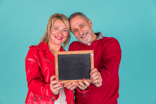 Aged couple showing frame