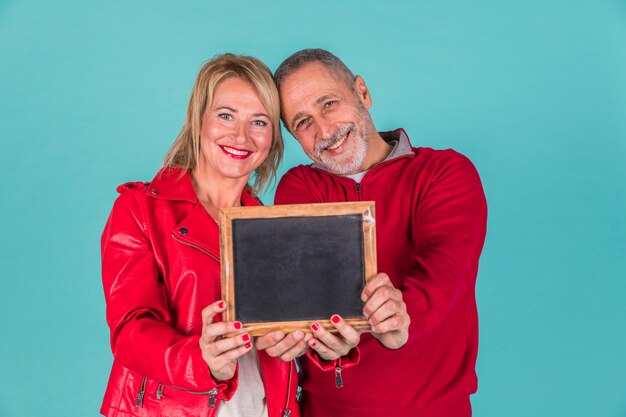 Aged couple showing frame