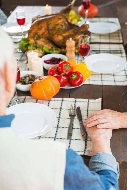 Aged couple sitting at festive table