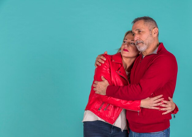 Aged man hugging with woman