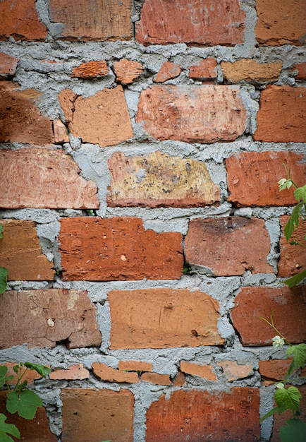 Free photo aged red brick with concrete wall texture