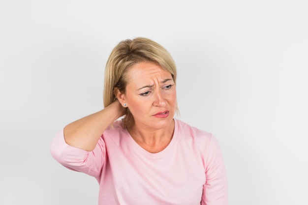 Free photo aged sad lady in pink blouse