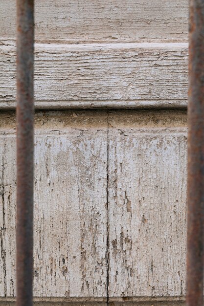 Aged wood surface and rusty metal bars