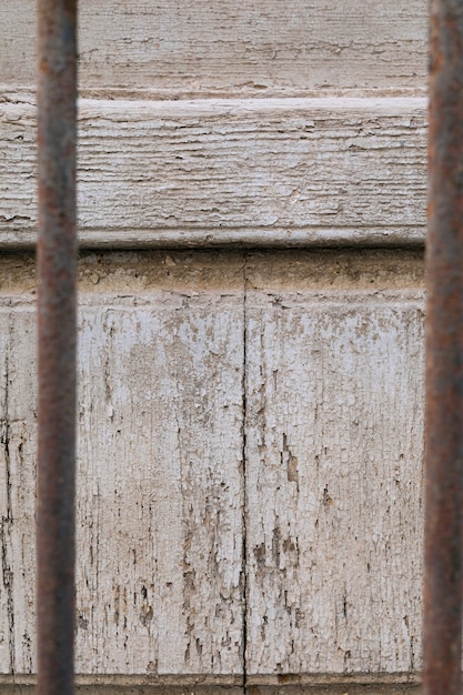 Aged wood surface and rusty metal bars