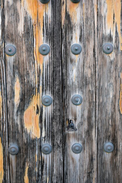Aged wood surface with metallic rivets