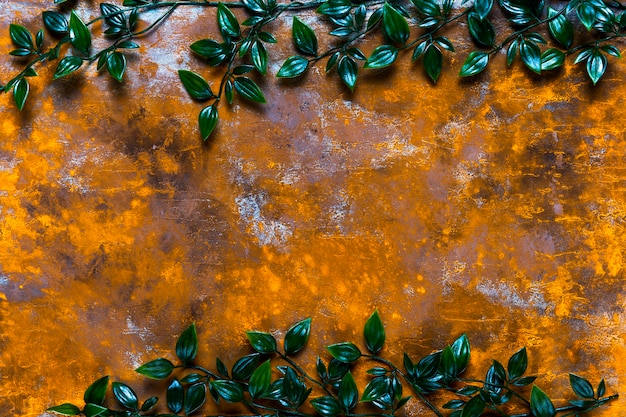 Free photo aged wood table with leaves