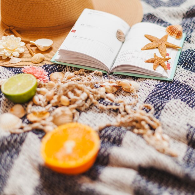 Agenda with beach elements and fruit