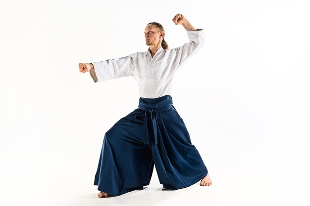 Aikido master practices defense posture.