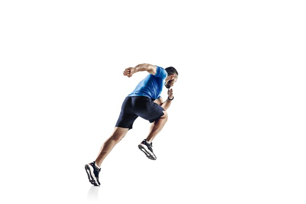 In air. Caucasian professional male athlete, runner training isolated on white  background.