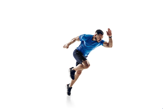 In air. Caucasian professional male athlete, runner training isolated on white  background.
