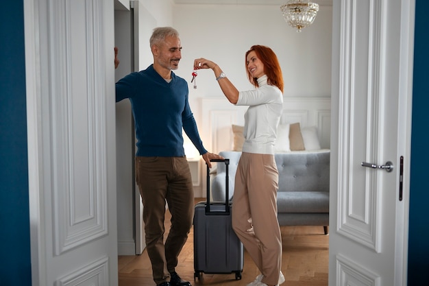 Free photo airbnb host welcoming guests