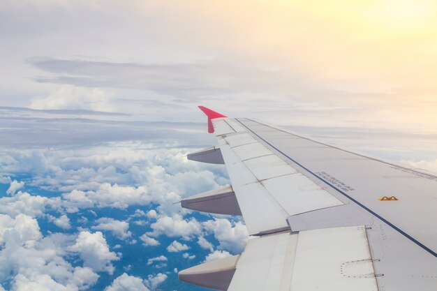 Airplane flying above the clouds