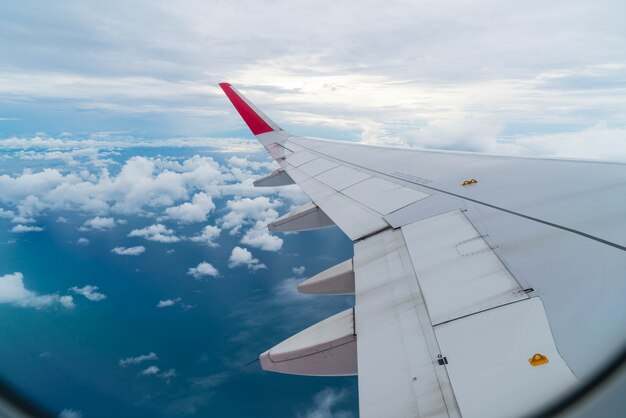 Airplane flying above clouds