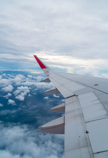 Free photo airplane flying above clouds