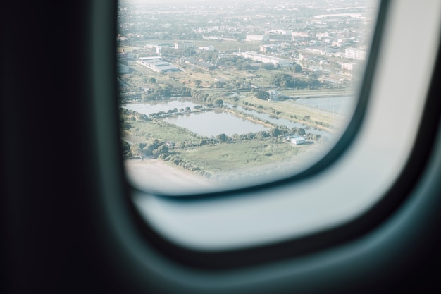 airplane window with city view