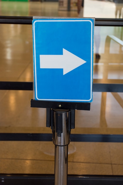 Airport arrow direction sign indoors