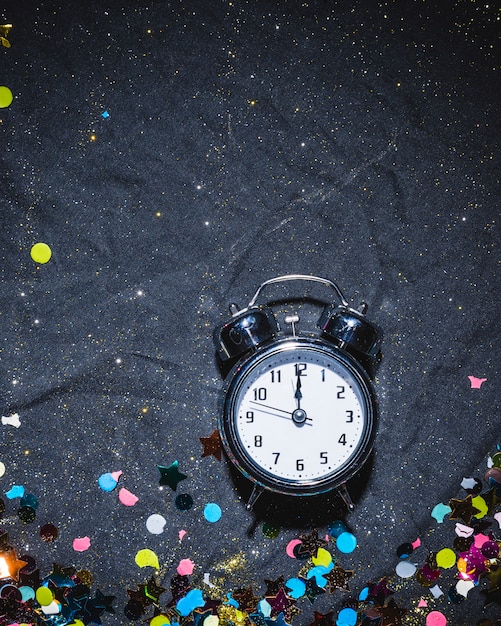 Alarm clock on festive floor